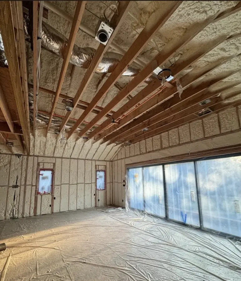 Interior walls and ceiling insulated with spray foam during new construction in Waterbury